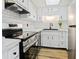 Modern kitchen with white cabinets, stainless steel appliances at 3800 Saxon Dr # C-52, New Smyrna Beach, FL 32169