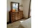 Bedroom with dresser and large mirror at 2292 Richey Rd, The Villages, FL 32163