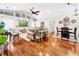Spacious living room with hardwood floors, built-in shelving, and a ceiling fan at 2172 Malachite Dr, Lakeland, FL 33810