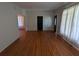 Living room with hardwood floors and access to other rooms at 2721 Woodland Hills Ave, Lakeland, FL 33803