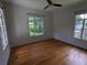 Hardwood floor bedroom with two large windows at 2721 Woodland Hills Ave, Lakeland, FL 33803