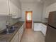Galley kitchen with granite countertops and stainless steel appliances at 2721 Woodland Hills Ave, Lakeland, FL 33803