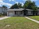 Charming bungalow with a newly paved driveway at 2721 Woodland Hills Ave, Lakeland, FL 33803