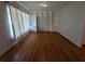 Hardwood floors and built-in shelving in living room at 2721 Woodland Hills Ave, Lakeland, FL 33803