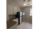 Kitchen with white cabinets, granite counters, and stainless steel appliances at 2721 Woodland Hills Ave, Lakeland, FL 33803