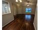 Living room featuring hardwood floors and a view to the front yard at 6059 Magpie Dr, Lakeland, FL 33809