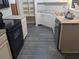 Kitchen with dark wood accent wall and stainless steel appliances at 6059 Magpie Dr, Lakeland, FL 33809