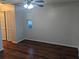 Bedroom with ceiling fan and laminate wood flooring at 6059 Magpie Dr, Lakeland, FL 33809
