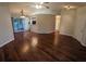 Open living room with hardwood floors and multiple access points at 6059 Magpie Dr, Lakeland, FL 33809
