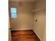Laundry room with shelving and laminate wood flooring at 6059 Magpie Dr, Lakeland, FL 33809