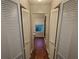Hallway with wood-look floors and built-in storage at 6059 Magpie Dr, Lakeland, FL 33809