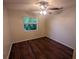 Bright bedroom with ceiling fan and laminate wood flooring at 6059 Magpie Dr, Lakeland, FL 33809