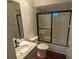 Clean bathroom with tub, shower, and wood-look flooring at 6059 Magpie Dr, Lakeland, FL 33809
