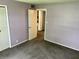 Bedroom with access to another room and neutral carpeting at 333 Lake Howard Nw Dr # 202C, Winter Haven, FL 33880