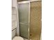 Shower stall with tiled walls and a sliding glass door at 333 Lake Howard Nw Dr # 202C, Winter Haven, FL 33880