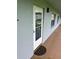 Inviting condo entrance with a glass door and doormat at 333 Lake Howard Nw Dr # 202C, Winter Haven, FL 33880