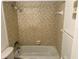 Simple bathroom with a tub and shower combination at 333 Lake Howard Nw Dr # 202C, Winter Haven, FL 33880