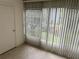 Sunroom with tiled floor and vertical blinds at 333 Lake Howard Nw Dr # 202C, Winter Haven, FL 33880