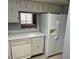 White appliances and cabinets, plus a built-in ice maker at 333 Lake Howard Nw Dr # 202C, Winter Haven, FL 33880