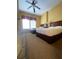 Well-lit guest bedroom with two double beds and ceiling fan at 8101 Resort Village Dr # 3303, Orlando, FL 32821