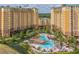 Luxury resort with multiple buildings, pools, and water features at 8101 Resort Village Dr # 3303, Orlando, FL 32821