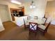 Bright dining area with glass table and kitchen access at 8101 Resort Village Dr # 3303, Orlando, FL 32821