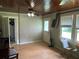 Spacious living room with wood-look floors and large windows at 815 E Church St, Bartow, FL 33830