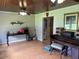 Living room with hardwood floors, piano, and access to kitchen at 815 E Church St, Bartow, FL 33830