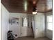 Cozy bedroom with wood ceiling, window, and exterior door at 815 E Church St, Bartow, FL 33830
