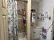 Clean bathroom with shower/tub combo, vanity, and storage at 815 E Church St, Bartow, FL 33830