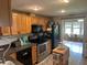Eat-in kitchen with stainless steel appliances and island at 815 E Church St, Bartow, FL 33830