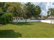 Large side yard with grassy area and white fence at 815 E Church St, Bartow, FL 33830
