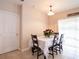 Dining area with table, chairs, and lace tablecloth at 4814 Rockvale Dr, Kissimmee, FL 34758