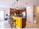 Kitchen with island, stainless steel appliances, and yellow accents at 4814 Rockvale Dr, Kissimmee, FL 34758