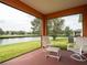 Relaxing screened porch overlooking a lake at 4814 Rockvale Dr, Kissimmee, FL 34758