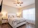 Bright bedroom with queen bed and wood floors at 4814 Rockvale Dr, Kissimmee, FL 34758