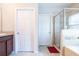 Bathroom with a double vanity, separate shower and tub at 4814 Rockvale Dr, Kissimmee, FL 34758