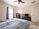 Spacious bedroom with a large bed, dresser, and TV at 4814 Rockvale Dr, Kissimmee, FL 34758