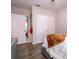 Bedroom with gray upholstered bed and wood floors at 4814 Rockvale Dr, Kissimmee, FL 34758