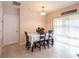 Dining area with table and chairs near sliding glass door at 4814 Rockvale Dr, Kissimmee, FL 34758