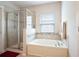 Bathroom with a soaking tub and a separate shower at 4814 Rockvale Dr, Kissimmee, FL 34758