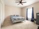 Bedroom with double bed, window, and dresser at 4814 Rockvale Dr, Kissimmee, FL 34758