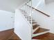 White and wood staircase leading to the upper level of the home at 1010 Martin Luther King Jr Blvd, Bartow, FL 33830