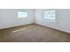 Spacious bedroom with two windows and carpet flooring at 1010 Martin Luther King Jr Blvd, Bartow, FL 33830