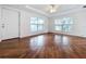 Living room with hardwood floors and large windows at 1010 Martin Luther King Jr Blvd, Bartow, FL 33830