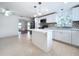 Bright kitchen featuring an island and white cabinets at 1010 Martin Luther King Jr Blvd, Bartow, FL 33830