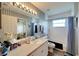 Bathroom with shower/tub combo, toilet, and vanity with a large mirror at 2178 Sunstone Dr, Lakeland, FL 33813
