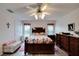 Bright bedroom with a floral bedspread and ample closet space at 2178 Sunstone Dr, Lakeland, FL 33813