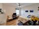 Cozy bedroom featuring a comfortable bed, dresser, and hardwood floors at 2178 Sunstone Dr, Lakeland, FL 33813