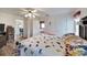 Main bedroom with a king-size bed and access to the bathroom and a small sitting area at 2178 Sunstone Dr, Lakeland, FL 33813